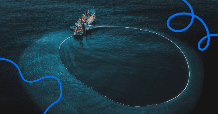 An aerial view of a small fishing boat cutting a wide circle across dark water.